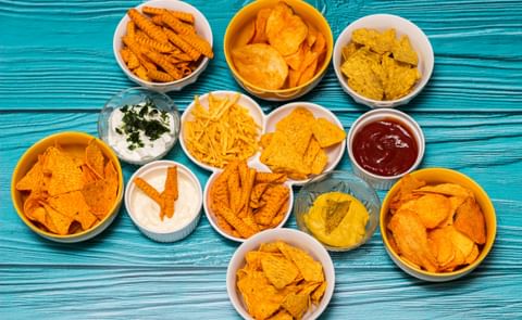 Assortment of salty snacks with dipping sauce Assortment of salty snacks with dipping sauce