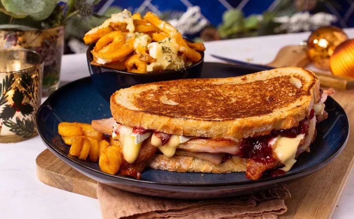 Sam Holland has created delicious recipes to use up leftovers, including an easy but indulgent sour dough sandwich oozing with turkey, cranberry sauce, bacon and melted brie (Courtesy: Lamb Weston) Sam Holland has created delicious recipes to use up leftovers, including an easy but indulgent sour dough sandwich oozing with turkey, cranberry sauce, bacon and melted brie (Courtesy: Lamb Weston)