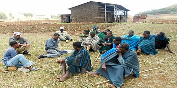  Semagn-Asredie Kolech with Ethiopian farmers