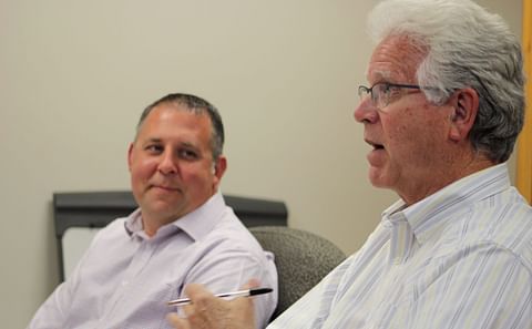 Newly hired Fort Fairfield Town Manager Tim Goff (left) listens as Dan Foster, outgoing interim town manager, address the council Wednesday, Sept. 20. (Courtesy: The Star-Herald)
