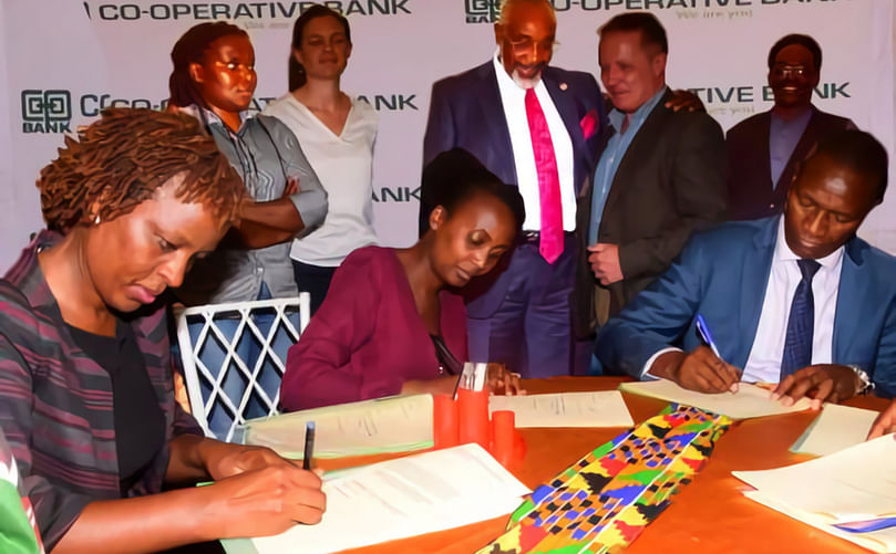 From the left: Esther Kariuki ( Head of Agri Cooperative at Co-op Bank), Carol Mumo (Social Impact Mar Yara East Africa) and Dr. Kiarie Moses N. Badilisha ( Nyandarua County Governor) signing an M.O.U on March 7, 2023. Courtesy: Co-op Bank