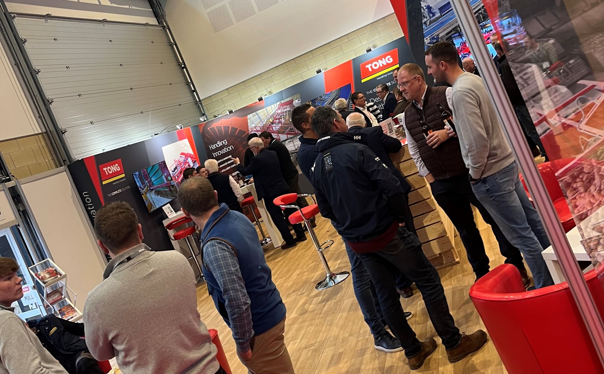 Visitors engage with the Tong Engineering team at BP2025, where the company showcases its latest handling and automation solutions.