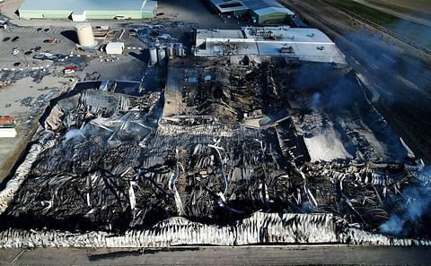 The Shearer’s Foods plant south of Hermiston still smolders Wednesday morning after a reported boiler explosion sparked a dramatic fire Tuesday afternoon at the snack food manufacturing facility. Courtesy: Brandon Artz.