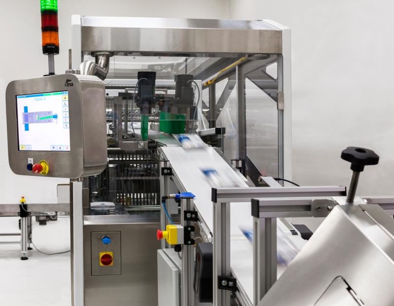 The tna Ropac 5 case packer in action The tna Ropac 5 case packer in action