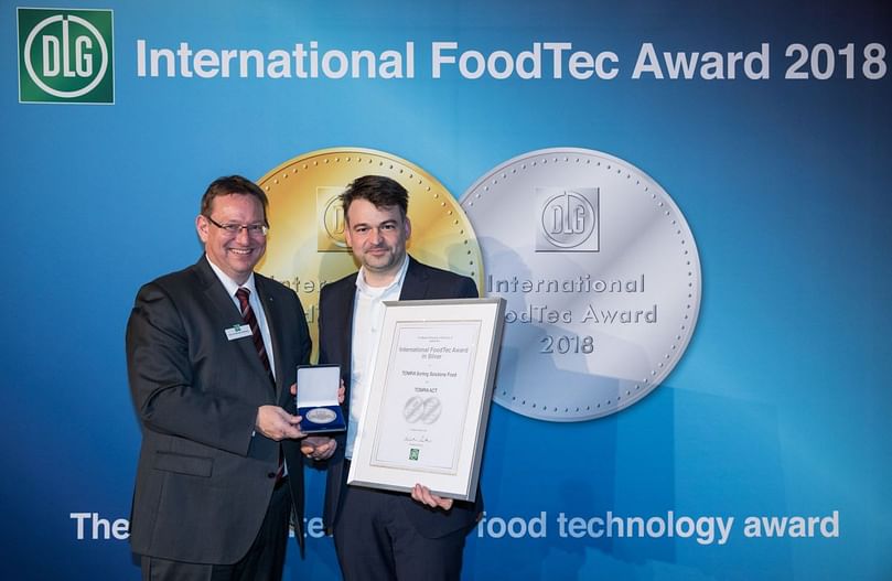 Karel Strubbe, Regional Sales Director EMEA at TOMRA Food receiving the award.