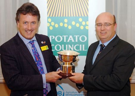 Tony Bambridge (right) receives the 2011 British Potato Industry award from Allan Stevenson (left)