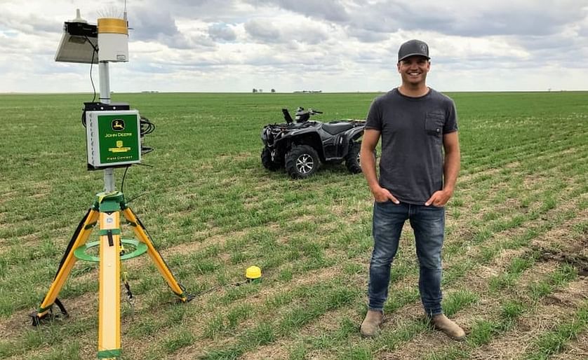 Agronomist Tyler Kessler stands next to a moisture probe in a durum wheat crop south of Regina. Kessler runs a consulting business in southern Saskatchewan that advises farmers on precision farming, including the best timing and methods for fertilizer app
