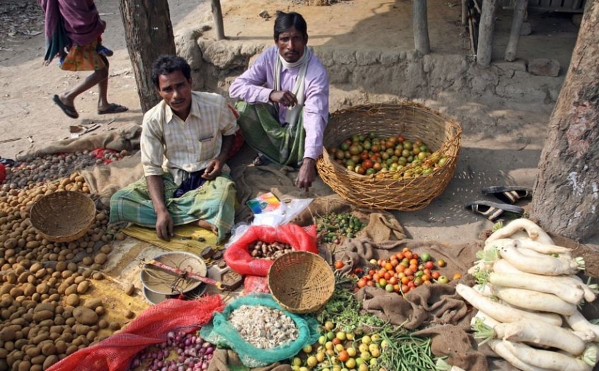 Tribal villagers bargain for vegetables on January 14, 2009. Kumrokhali, West Bengal, India.