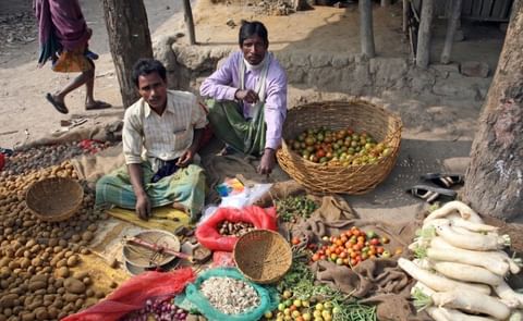 Tribal villagers bargain for vegetables on January 14, 2009. Kumrokhali, West Bengal, India. Tribal villagers bargain for vegetables on January 14, 2009. Kumrokhali, West Bengal, India.