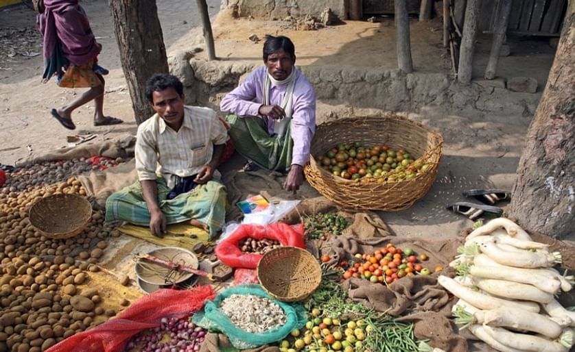 Tribal villagers bargain for vegetables on January 14, 2009. Kumrokhali, West Bengal, India.