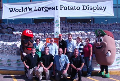 World largest potato display, featuring a final total of 92,500 pounds of Prince Edward Island potatoes and its creators: Front: Chris MacDonald, Derek MacLeod, and Kevin Kane from Sobeys;John Griffin from WP Griffin Inc.  Back:  “Bud the Spud”;Denise Kelly, Jeff Jenkins, Chris Gillis, and Damien Noonan from Sobeys;Kendra Mills, PEI  Potato Board;Christina Blanchard, WP Griffin Inc.
