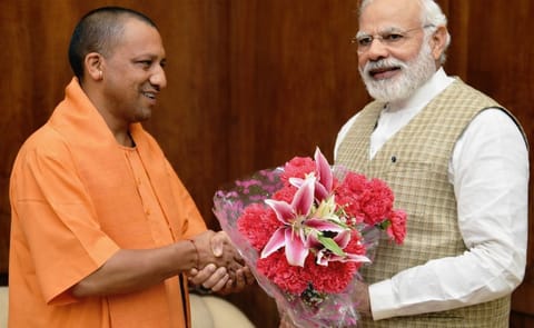 India's Prime Minister Narendra Modi (right) congratulates Uttar Pradesh Chief Minister Yogi Adityanath (left) India's Prime Minister Narendra Modi (right) congratulates Uttar Pradesh Chief Minister Yogi Adityanath (left)