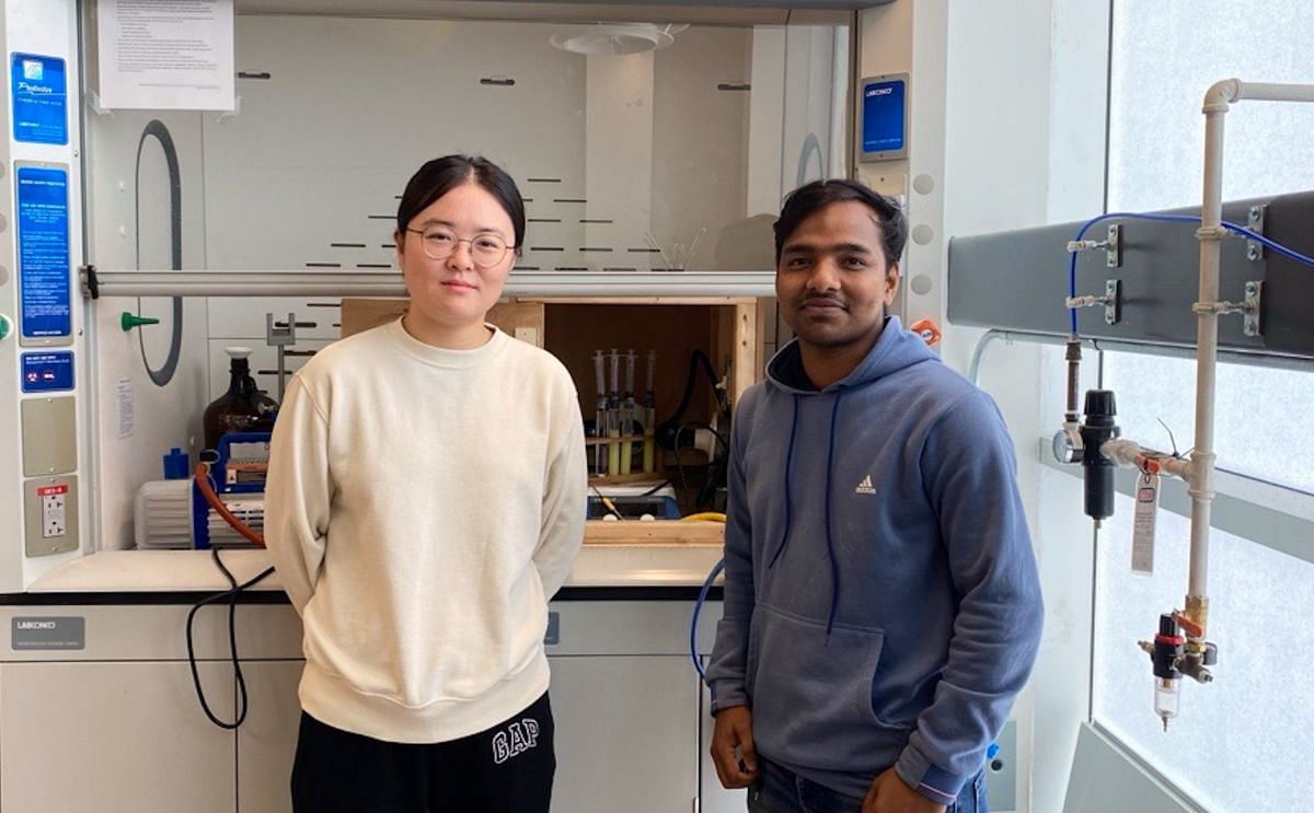 Yulin Hu, left, and Nasim Mia, right, are experimenting with hydrogen production at UPEI using sources such as potatoes, sawdust, and UV light.